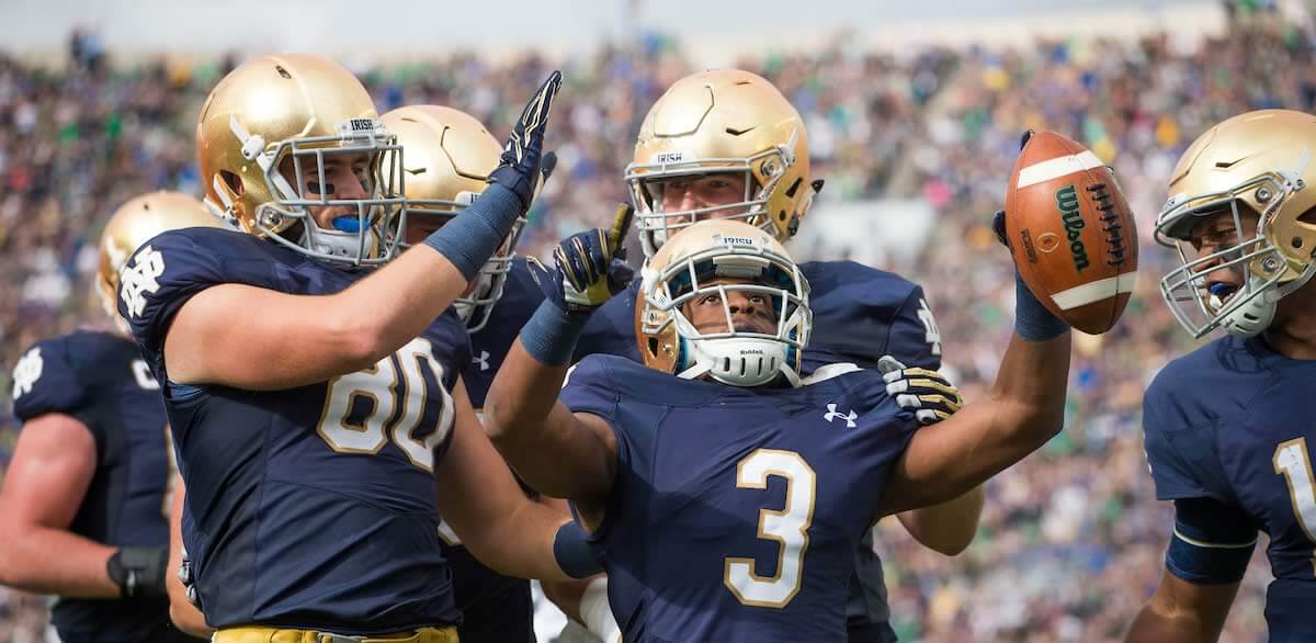 Notre Dame football players celebrating after a score